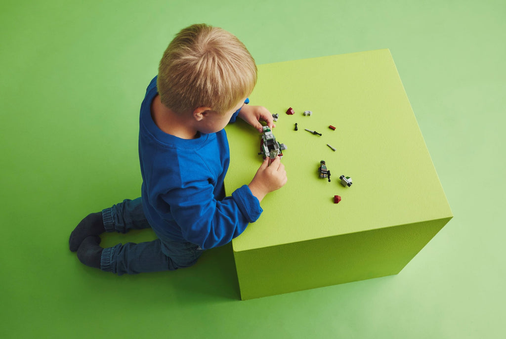 lifestyle - boy assembling the microfighter